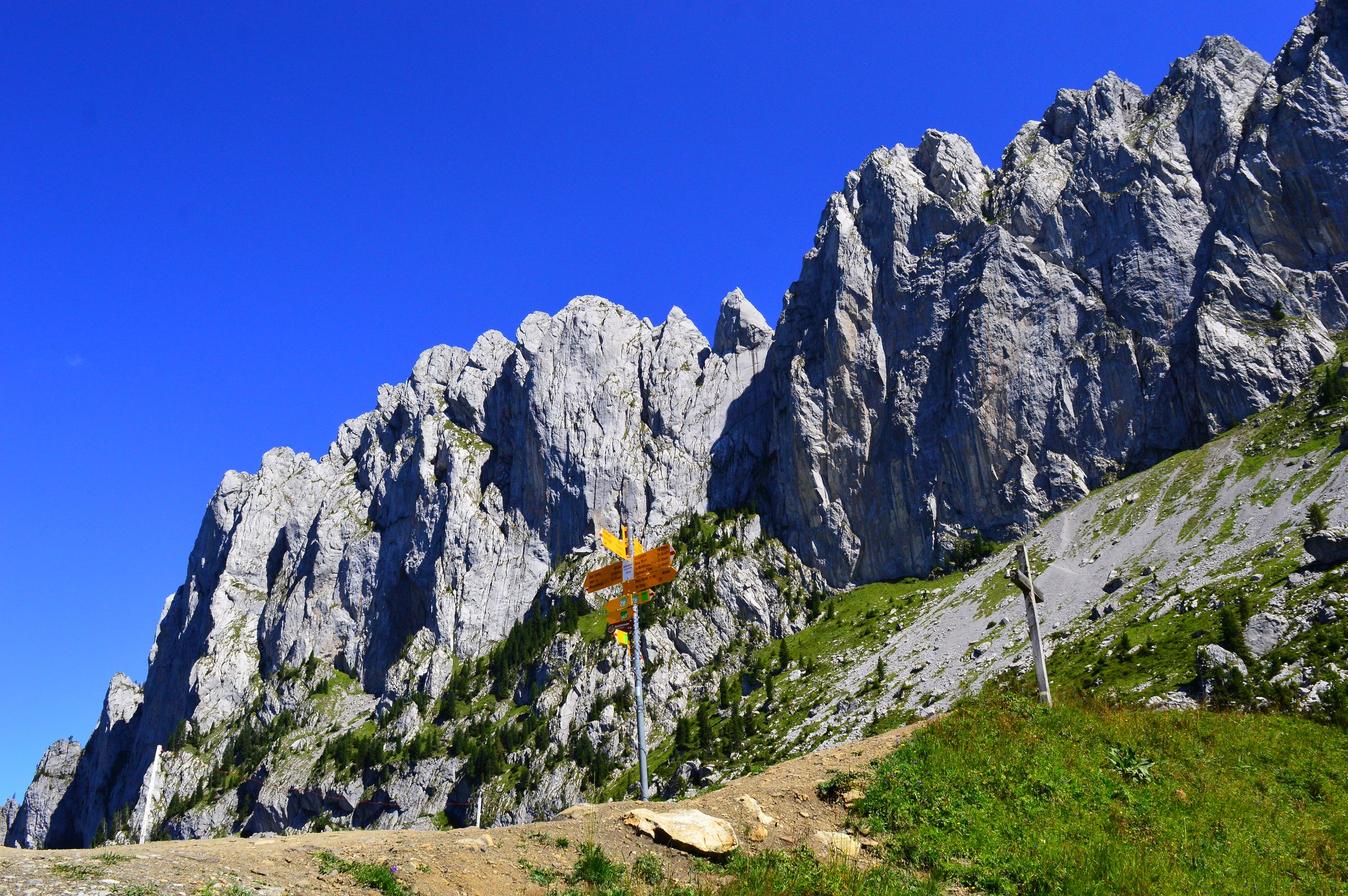 Vertical limestone walls of the Gastlosen against a deep blue sky